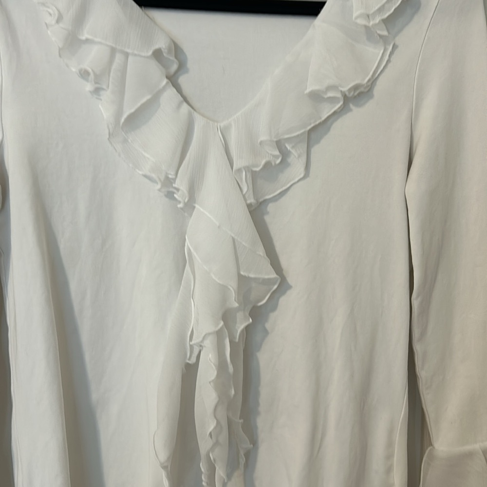 Ruffled white top